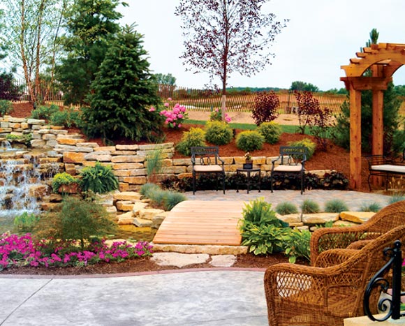 landscaping with rock walls, waterfall and pergola
