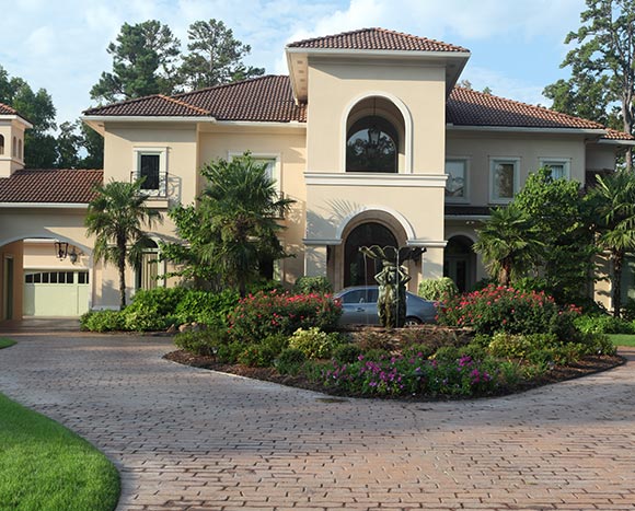 landscaped entrance of southwestern mansion