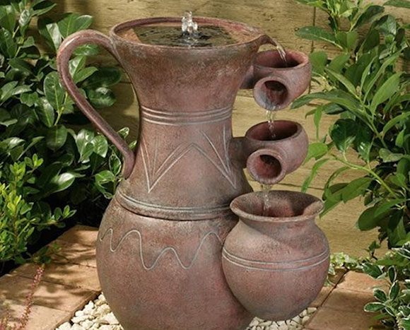 old pitcher and pot fountain water feature